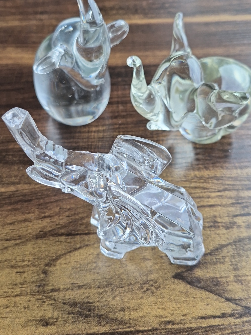 A Set of Three Glass Elephant Paperweights
